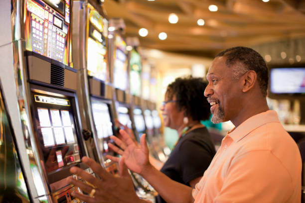 99slot mobile app showing Caribbean Stud Poker table selection screen